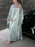 Abaya satinée à plumes